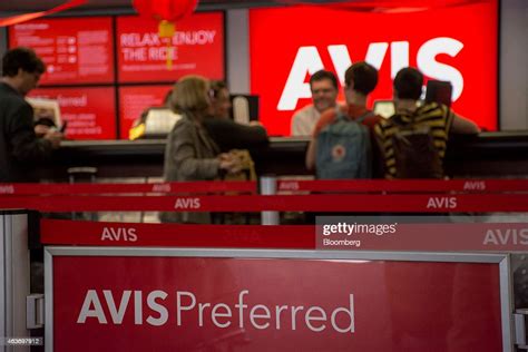 An Avis Budget Group Inc Employee Helps Customers At The Company S An Avis Budget Group Inc Employee Helps Customers At The Company S
